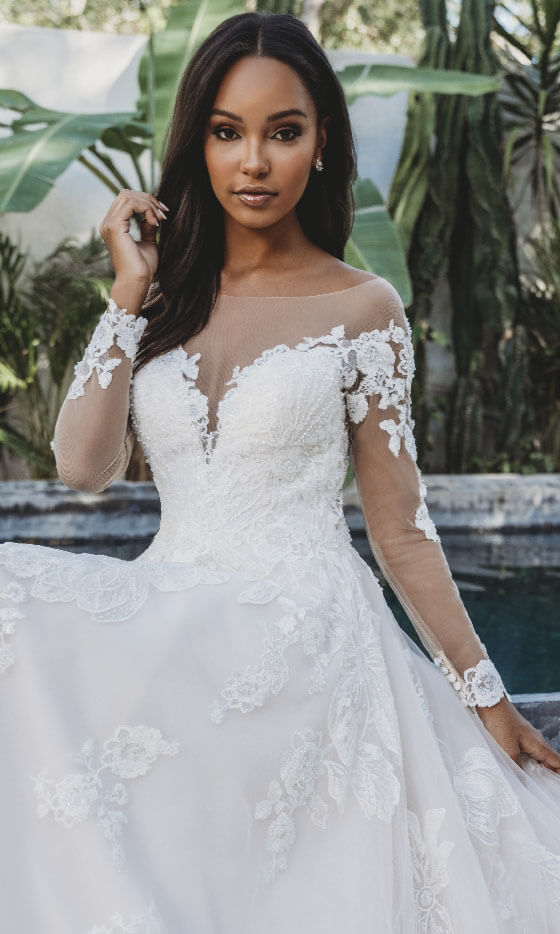 Model wearing a Long Sleeved Style gown. Desktop image