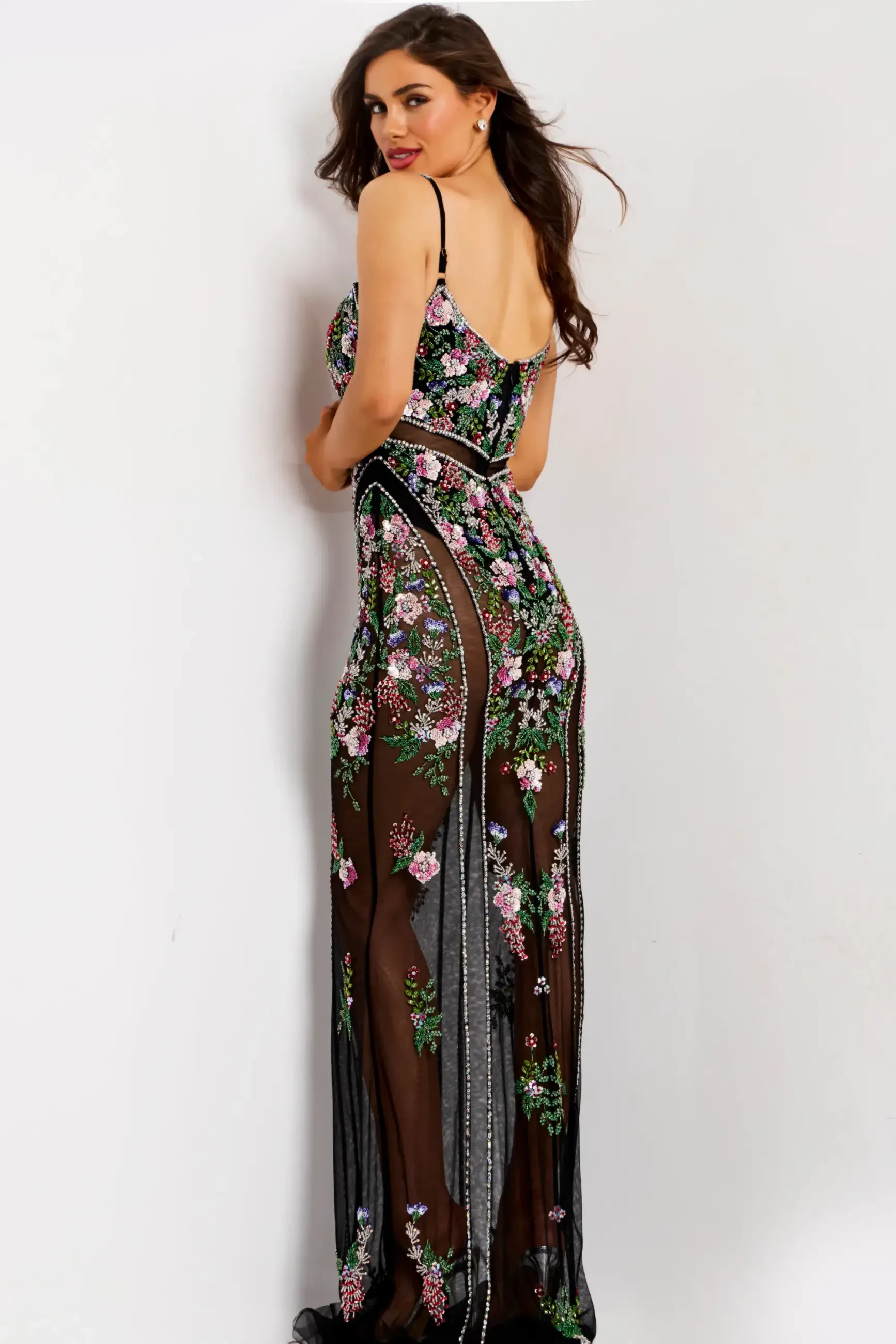 model is wearing a sleeveless fitted floral prom dress