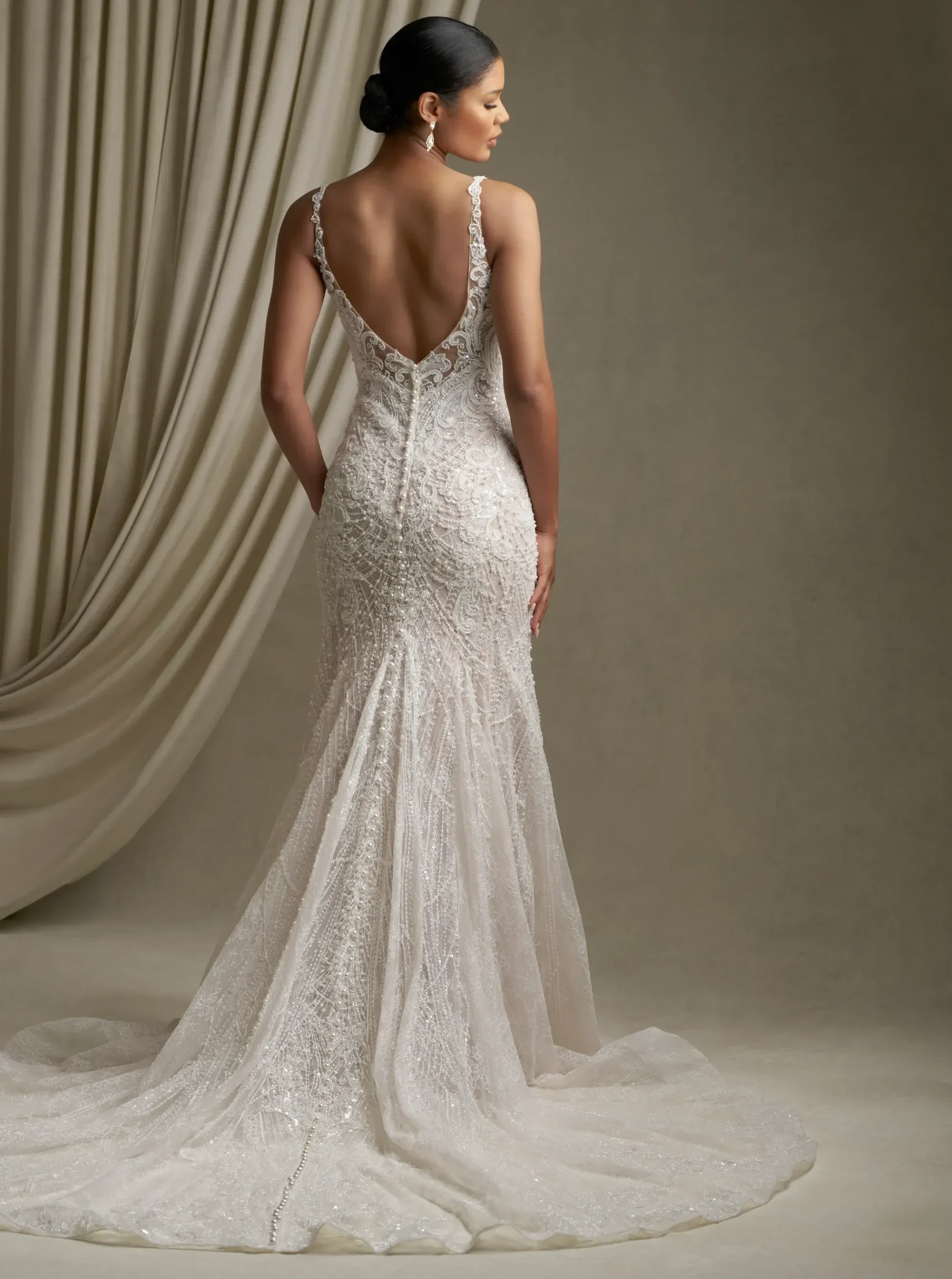 Model wearing a Flattering Back Style gown. Desktop image